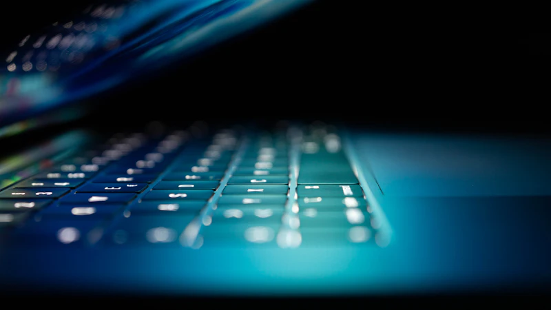 Laptop keyboard lit in blue representing endpoint detection and response