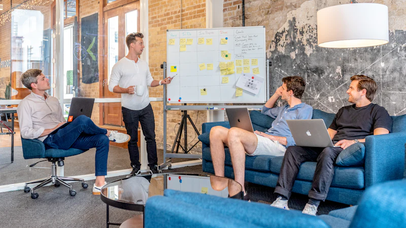 Team planning a disaster recovery strategy at a whiteboard