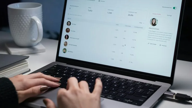 Laptop screen showing a user management dashboard