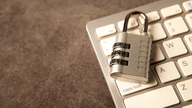 Padlock on a laptop keyboard representing workstation security