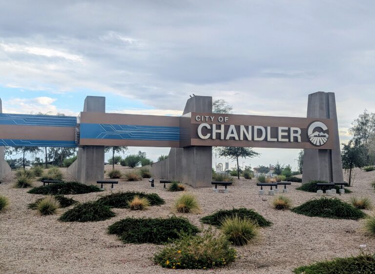 City of Chandler welcome sign with blue circuit-board graphic in Chandler, Arizona