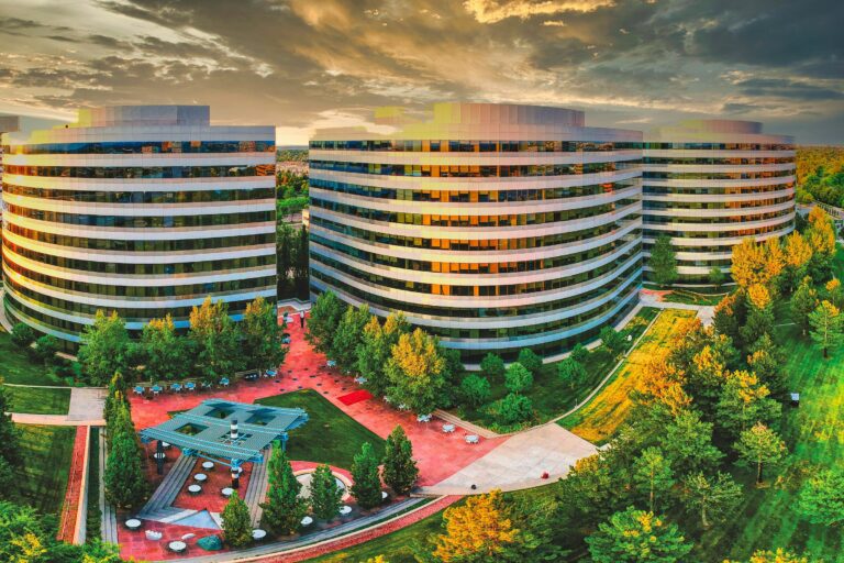 Curved office buildings and a landscaped plaza in Greenwood Village, next to Centennial, Colorado