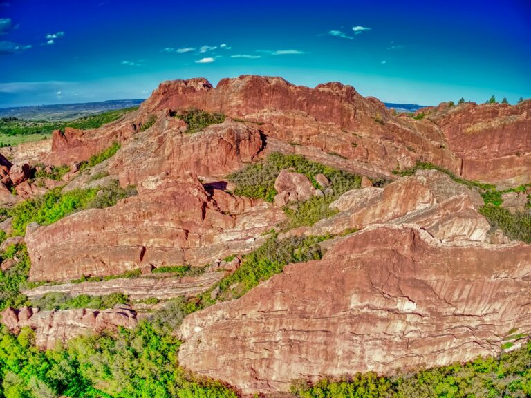 Red sandstone formations under a blue sky near Littleton, Colorado