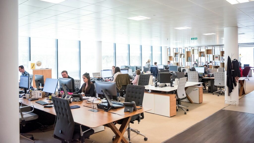 Employees working at desks in an open office