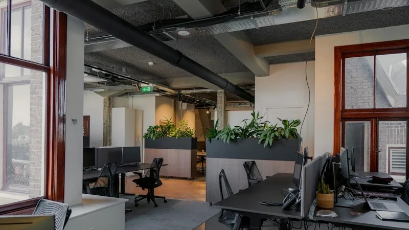 Open office with rows of desks and computers ready for a new team