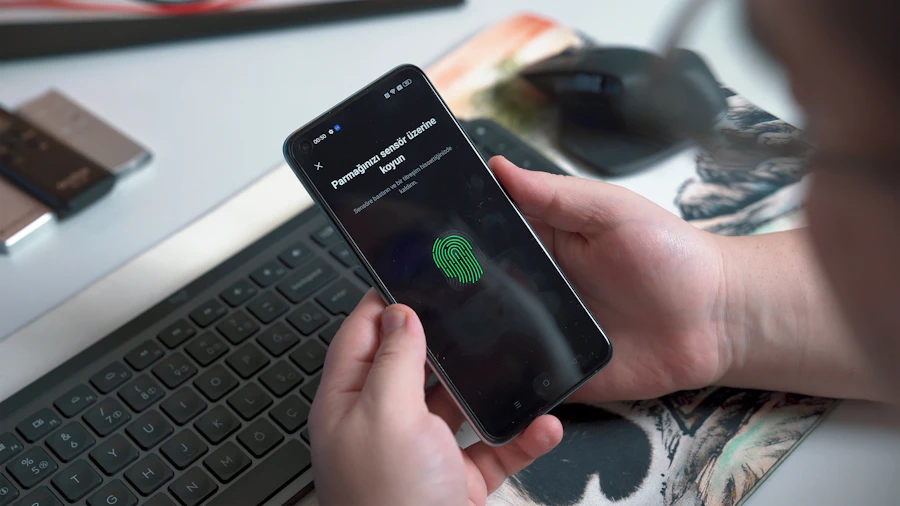 Person approving a secure sign-in on a phone beside a laptop