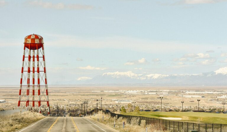 Checkered water tower and open valley view in West Valley City, Utah